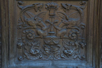 Entrance, old wooden door with carvings