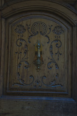 Entrance, old wooden door with carvings