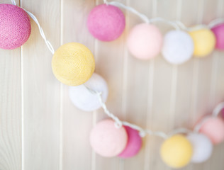 delicate, beautiful lanterns garlands like balls of yarn on a white background. decorations