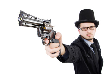 Young detective in black coat holding handgun isolated on white