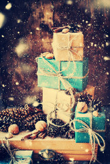 Stack of Holiday Boxes with Linen Cord, Nuts. Drawn Snow