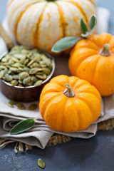 Pumpkins with seeds and sage leaves