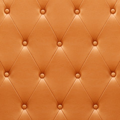 Pattern of orange leather seat upholstery