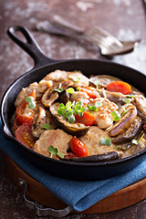 Chicken with tomatoes and eggplant