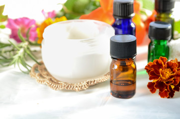 Obraz na płótnie Canvas essential oils with cream for aromatherapy treatment