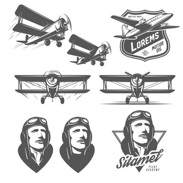 Set of vintage aircraft design elements. Biplanes, pilots, design emblems