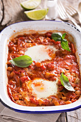 Baked eggs with vegetables and chickpeas