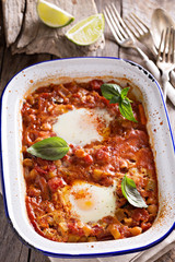 Baked eggs with vegetables and chickpeas