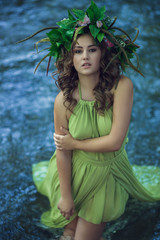 portrait of beautiful girl with magic eyes in wreath and dress i