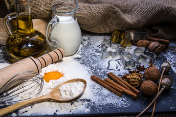 Baking ingredients for making dough on black board. Marry Christmas