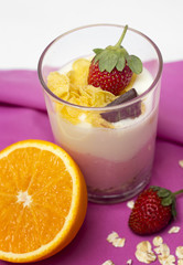 Yogurt in a glass with berries and muesli