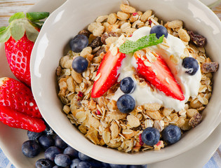  Breakfast -  berries, yogurt and  muesli.