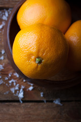 Mandarines and oranges in a wooden bowl for christmas
