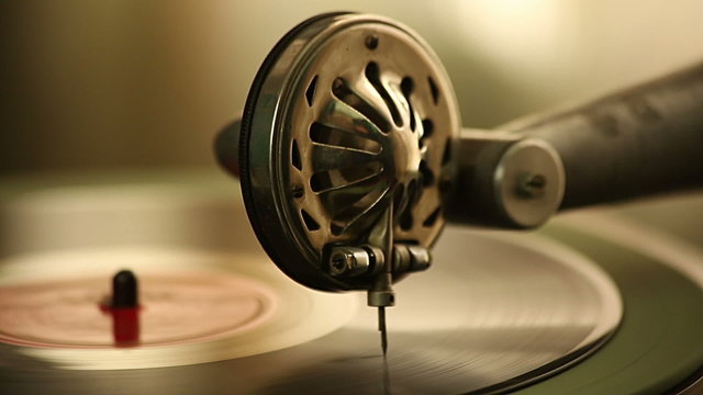 Vintage gramophone plays a record