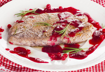 Turkey breast with sweet cranberry sauce.