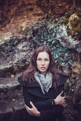 Fashion woman walking in dark autumn park