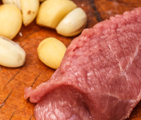 fresh raw meat on old wooden table