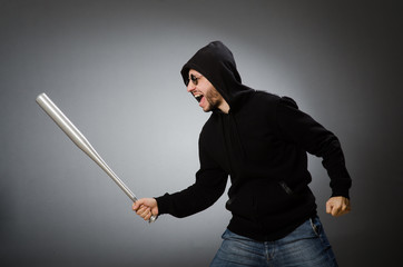 Aggressive man with basebal bat 