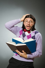 Young student with book in learning concept