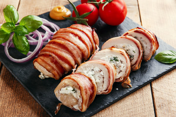chicken breast stuffed  feta cheese and herbs wrapped in bacon 