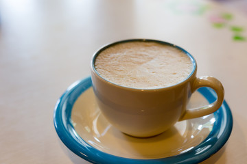 hot cappuccino coffee in white mug