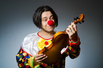 Funny violin clown player in musical concept © Elnur
