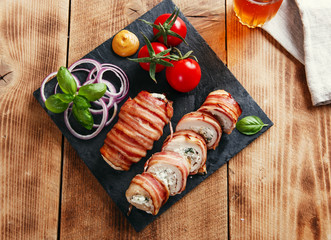 chicken breast stuffed  feta cheese and herbs wrapped in bacon 