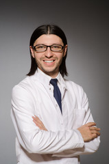 Young physician against gray