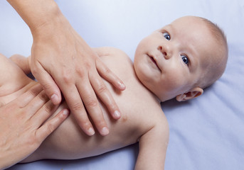Three month baby boy abdomen massage