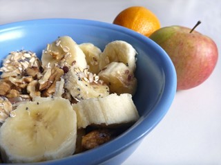 A  bowl with granola and banana