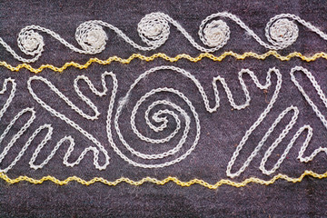 Natural patterns on vintage blanket with symbols