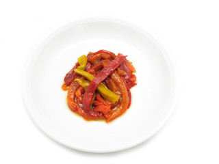 Roasted red, orange and yellow peppers on white background