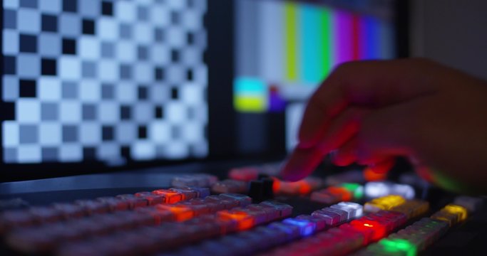 Hand Pulling The T-Bar On A Video Switcher