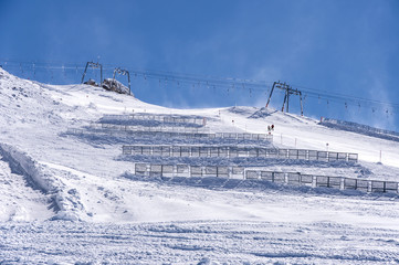 Ski lift and snow fences in Austrian Alps