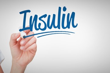 Insulin against female hand holding whiteboard marker