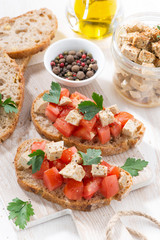 bread with tomatoes and marinated feta, top view