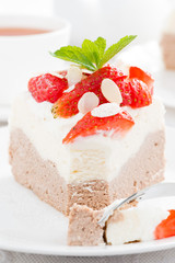 piece of delicious cake with whipped cream and strawberries