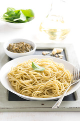 spaghetti with pesto on a plate