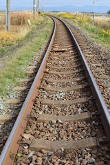 Fototapeta premium 羽越本線の線路（単線）／山形県の庄内地方で羽越本線の線路（単線）を撮影した、ローカルイメージの写真です。