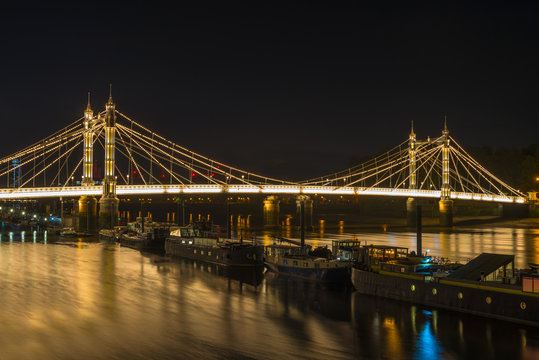 Illuminated Albert Bridge In West London At Night