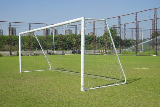 Soccer goal with net. Football goal on the field.