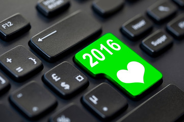 2016 written on a computer keyboard and a heart