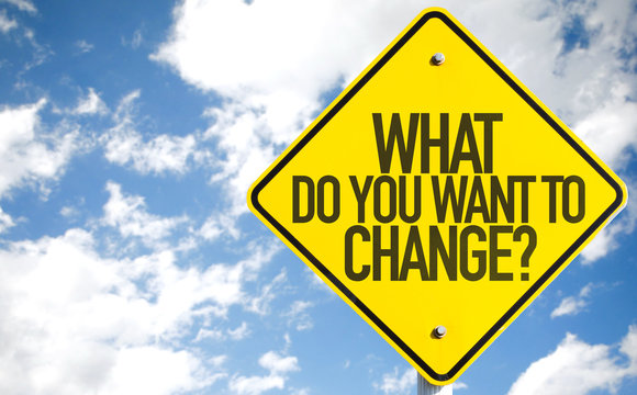 What Do You Want to Change? sign with sky background