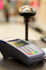 Credit Card Machine on cashier counter in the store : Selective