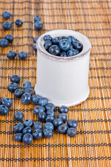 Decoration with blueberries on a bamboo mat