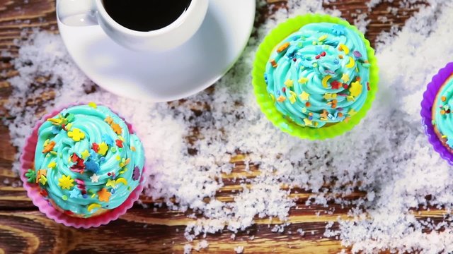 Christmas cupcakes in the snow on a wooden table