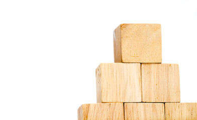close up at wood cube arrange in pyramid shape ,business concpt
