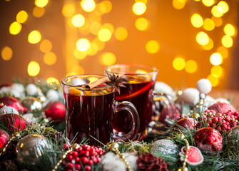 Christmas hot mulled wine with spices on a wooden table. The idea for creating greeting cards