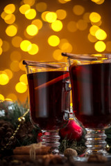 Christmas hot mulled wine with spices on a wooden table. The idea for creating greeting cards