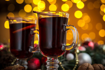 Christmas hot mulled wine with spices on a wooden table. The idea for creating greeting cards